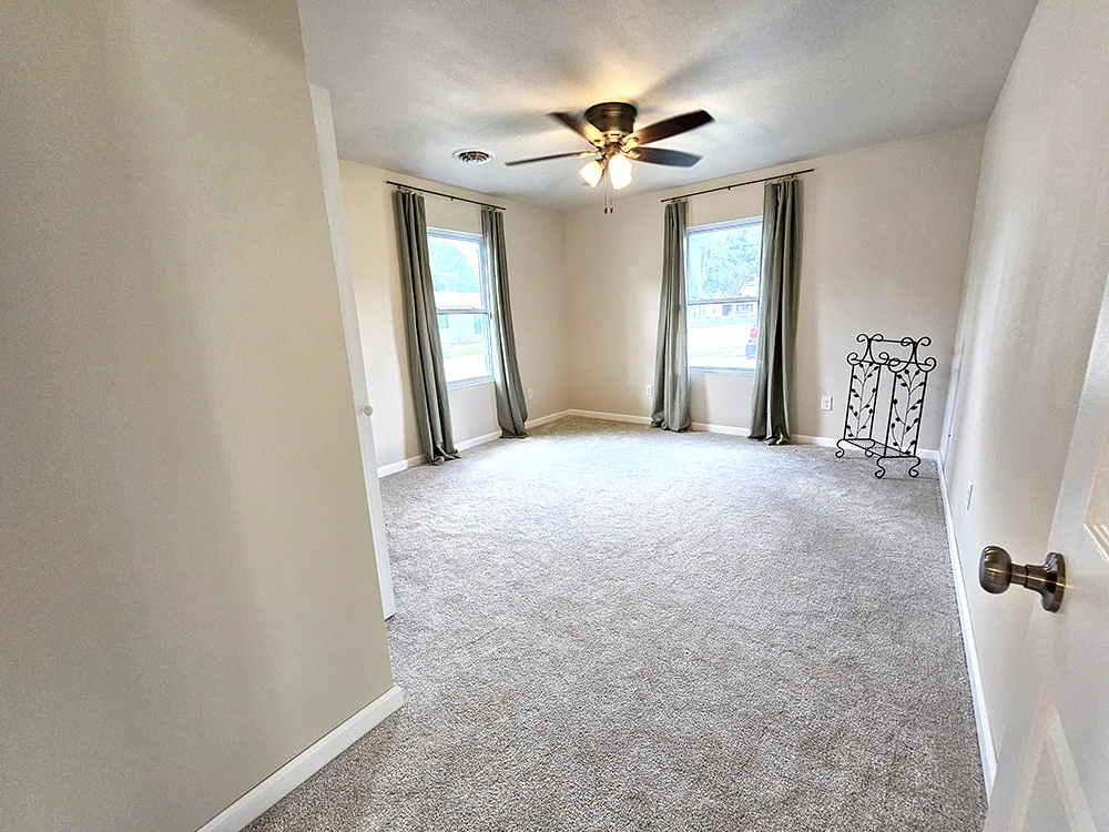 Enter this spacious master bedroom featuring a large wall mirror and a roomy closet, and enjoy a true touch of luxury.
