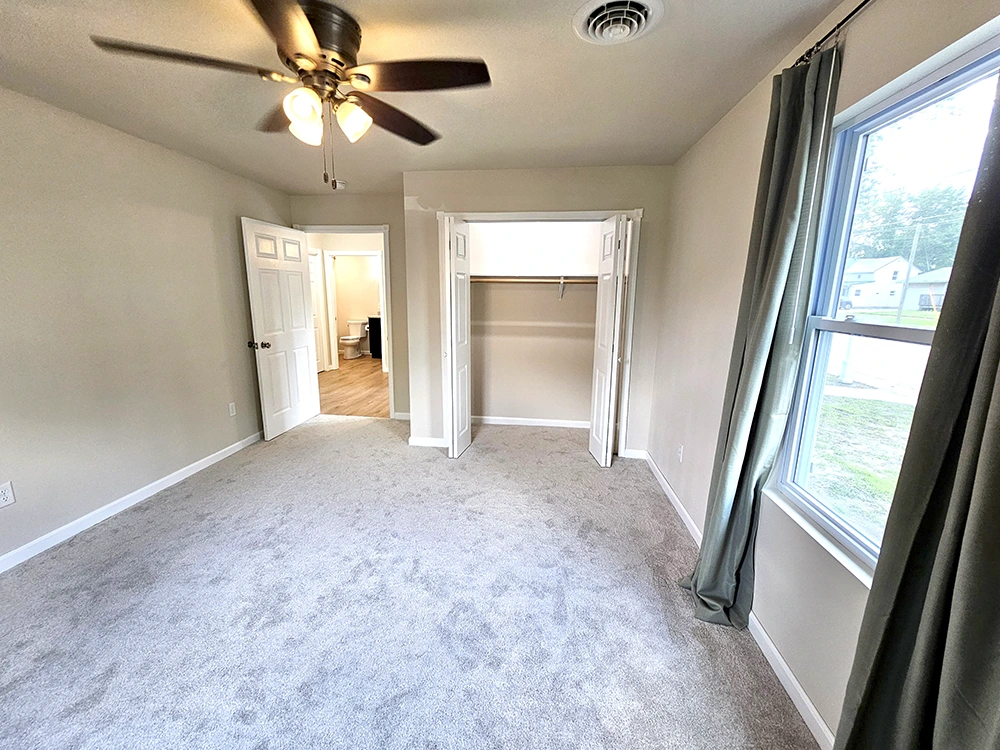 A large, well-illuminated closet enhances the master bedroom, providing ample space for all your storage needs.