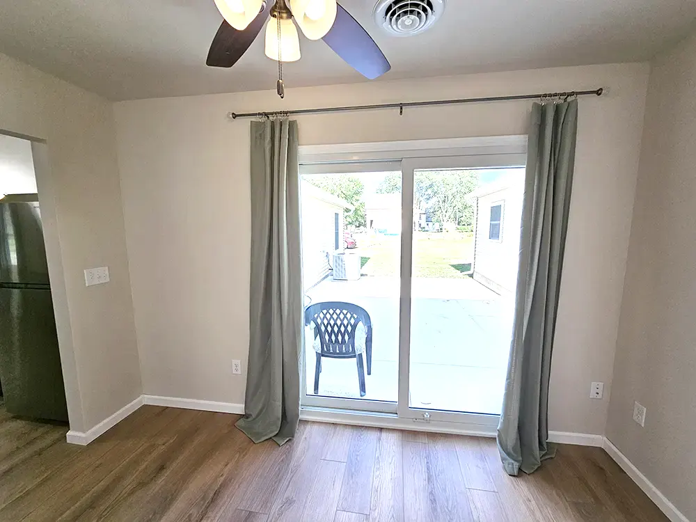A convenient sliding glass door opens directly to the spacious private patio and garage.